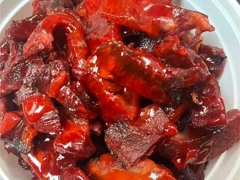 Glossy, sweet-savory roasted pork at Dragon King J, a Chinese Restaurant in New York