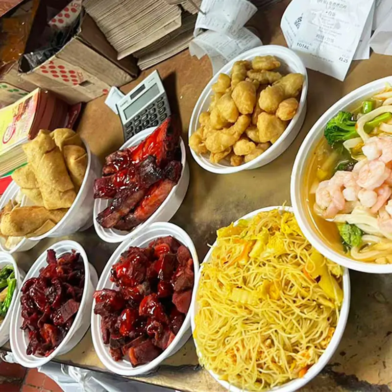Assorted Chinese dishes like BBQ pork and noodles at Dragon King J, a Chinese Restaurant in New York
