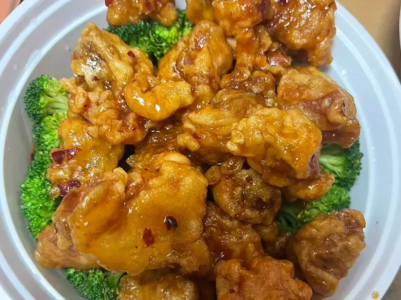 Crispy fried chicken in sweet honey-garlic sauce at Dragon King J, a Chinese Restaurant in New York